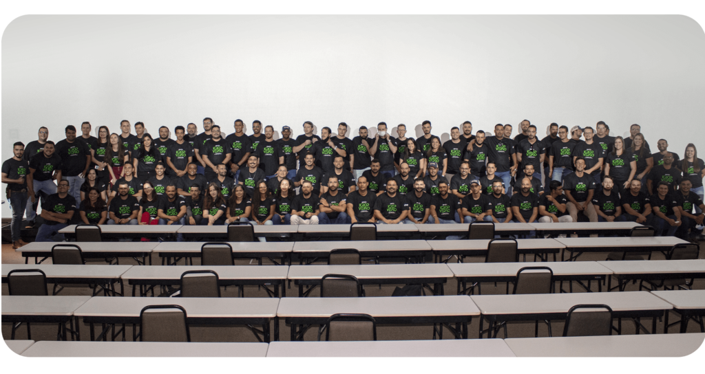 The image depicts our entire team, united in harmony, positioned on stage, forming a captivating photo that reflects the collaborative spirit.